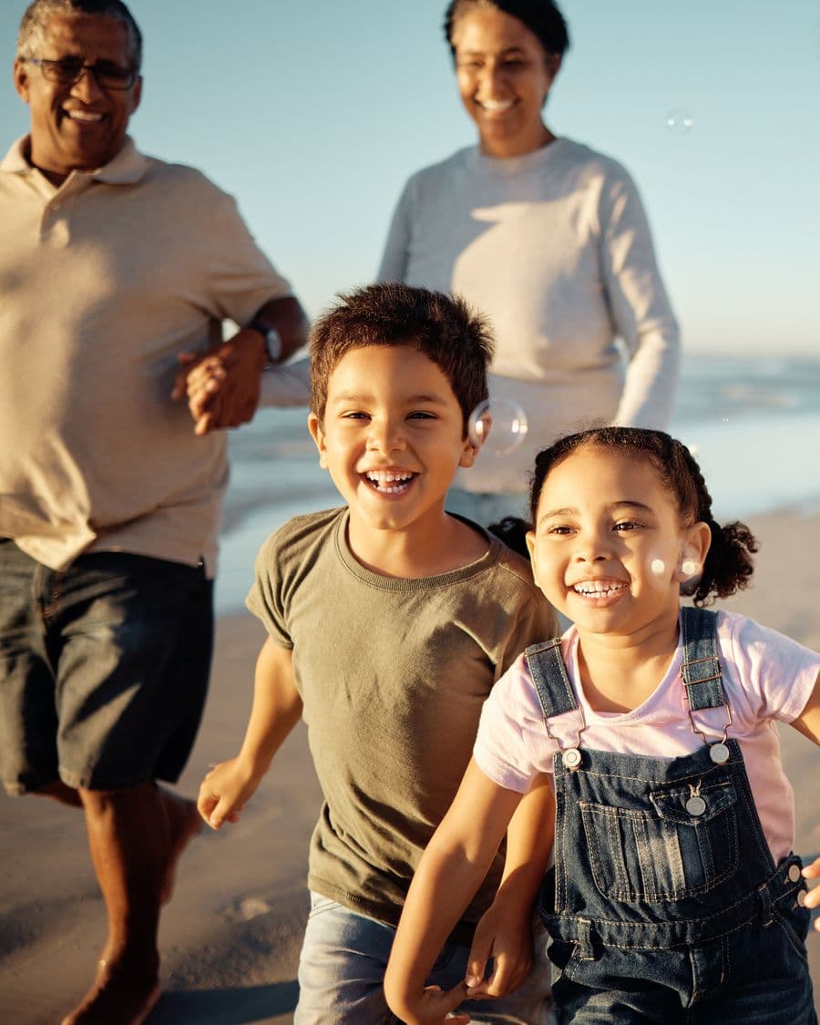 A family laughing together outdoors