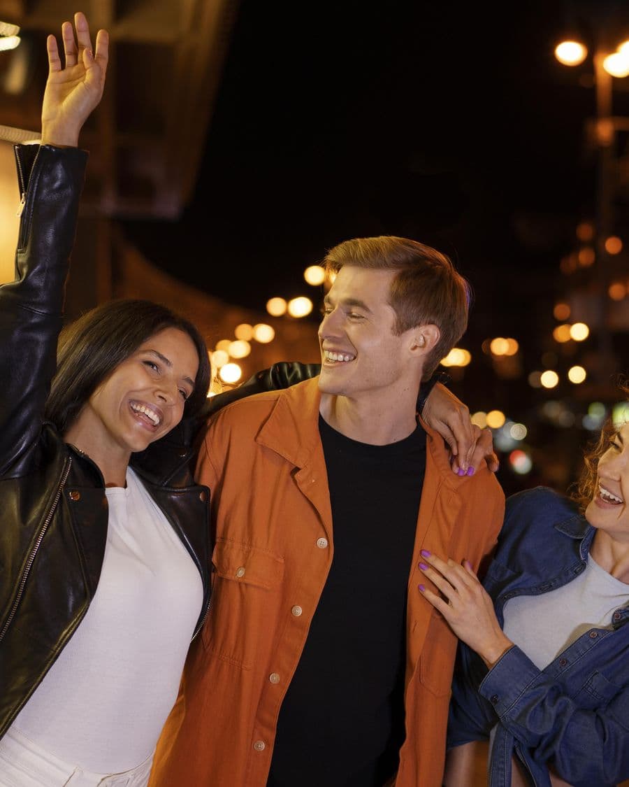 Friends laughing together on a night out